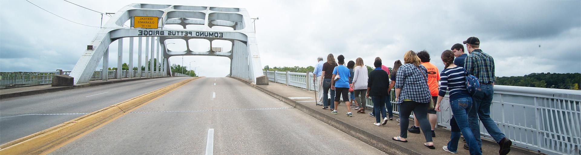 Cedarville University students crossing Edmund Pettus Bridge 1920